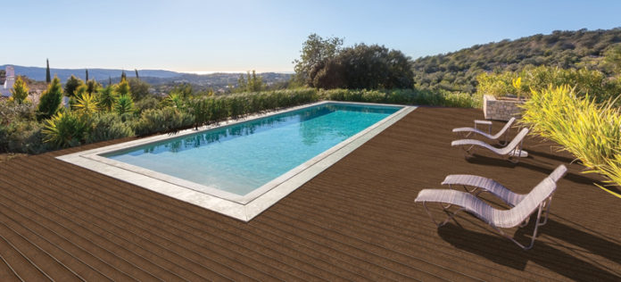 Luxury swimming pool for holidays. In the park with the sun.