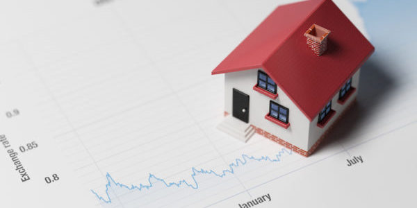 Miniature House on A Blue Financial Graph New home sales