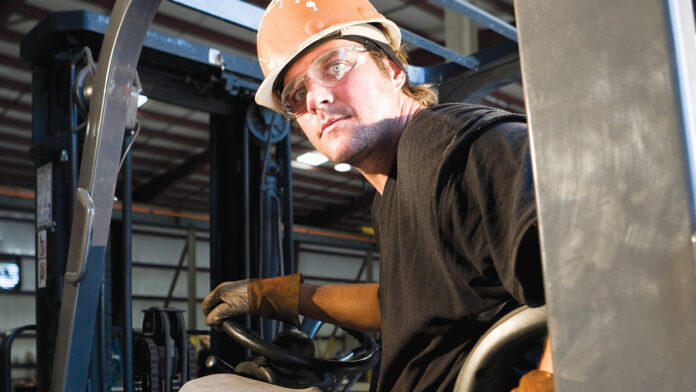 Male worker operating forklift in warehouse Real Issues Real Answers retaining people