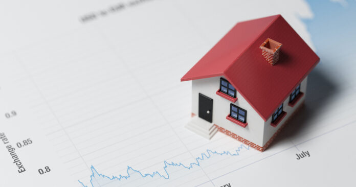 Miniature House on A Blue Financial Graph mortgage rates down payments