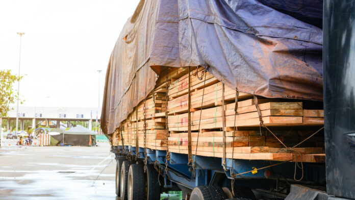 Timber transport truck Park waiting for inspection lumber supply truck NAHB